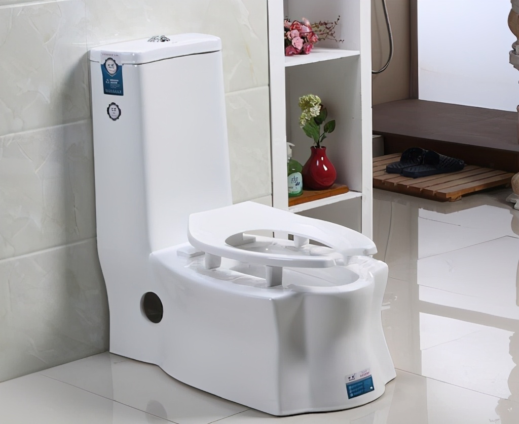 Why is there a gap in front of the toilet in American toilets?Is it