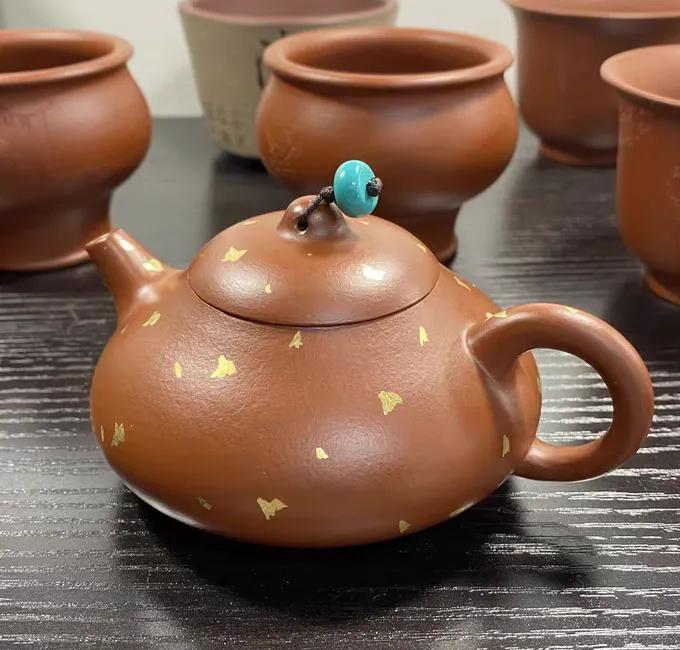 Purple clay teapot is both artistic and practical iNEWS