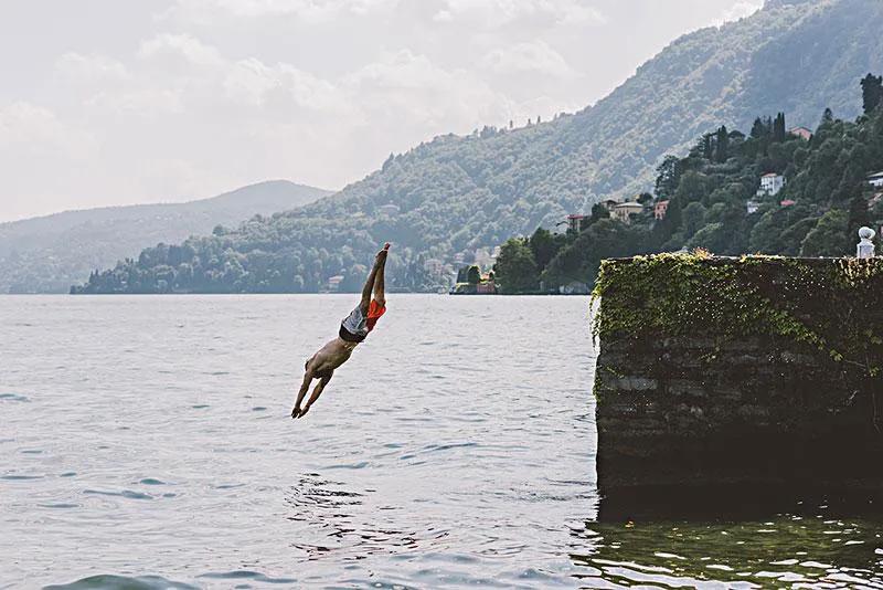 Why do male divers wear briefs to compete, and are not afraid of