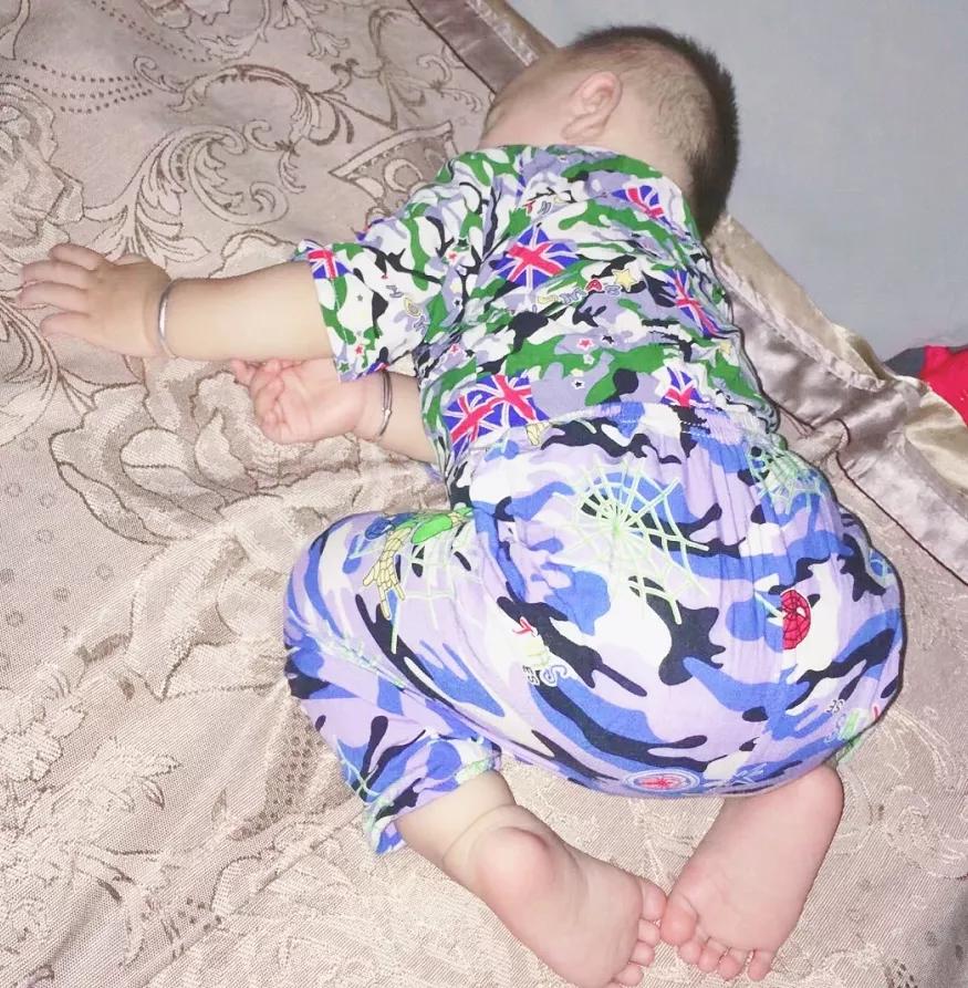 The small movements of baby sweating and waking up in sleep indicate