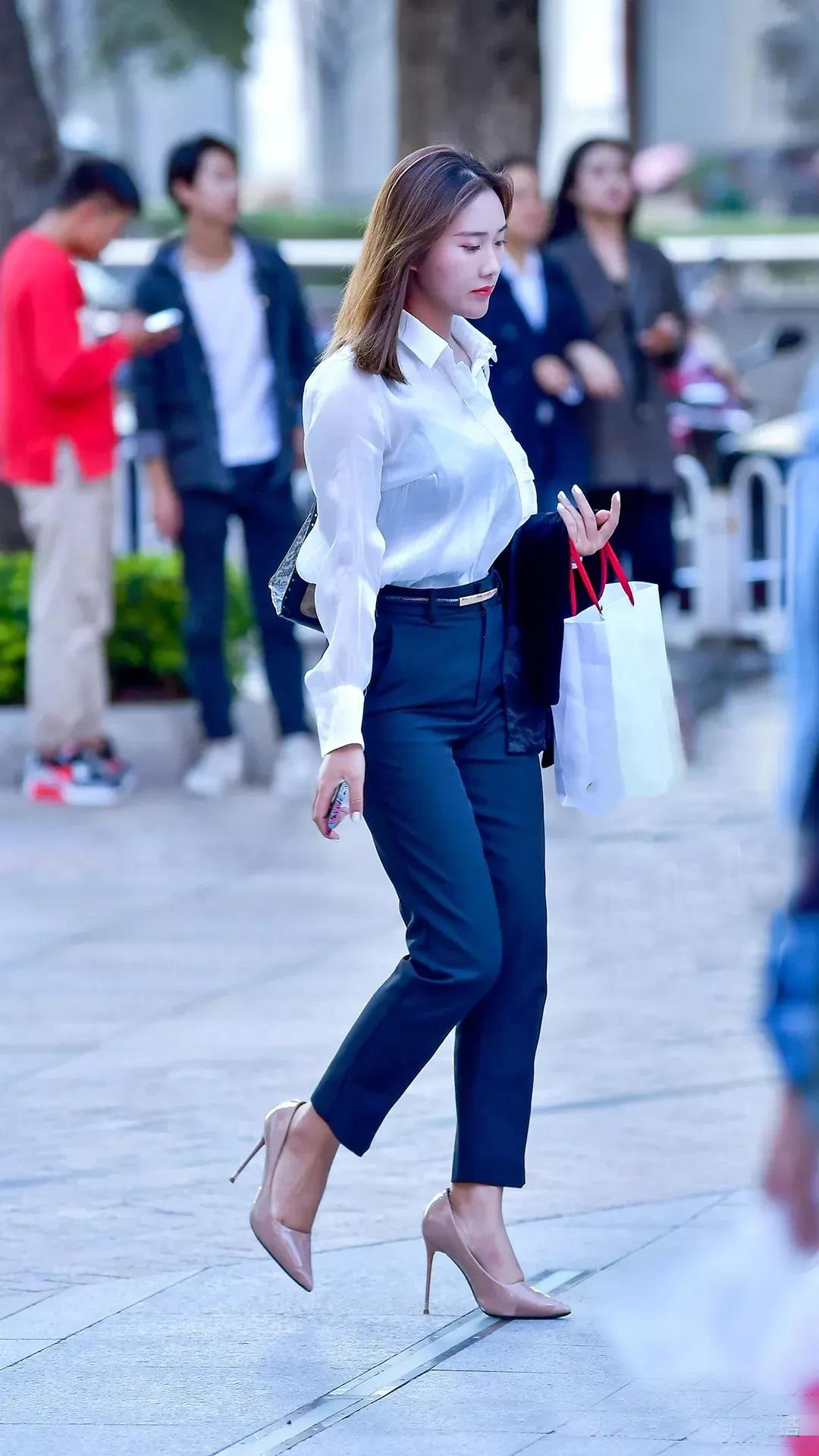 White shirt with navy blue pants iNEWS